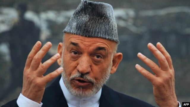 Afghan President Hamid Karzai speaks during a press conference at the Presidential Palace in Kabul on June 12.