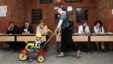 A woman and child at a Yerevan polling station for city elections on May 5