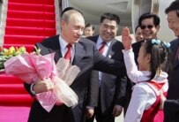 Russian President Putin being welcomed in China in March (epa)