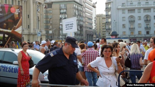 The political crisis has sparked protests by Romanians like these people in the capital, Bucharest, who fear the rule of law might be at stake.