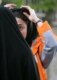 Police and Basij activists check women for proper dress in Tehran on April 22 (Fars)