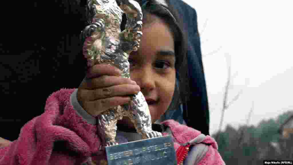 The couple's daughter shows off the Silver Bear award.