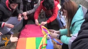 Mourners on January 23 attended the funeral of Isa Shahmarli, a 20-year-old gay-rights activist who was found dead in his Baku apartment of an apparent suicide. (Video by RFE/RL's Azerbaijani Service)
