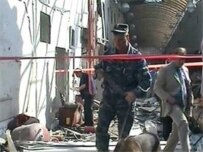 Police investigating the market blast on August 21 (RFE/RL)