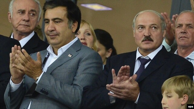 Georgian President Mikheil Saakashvili (left) and his Belarusian counterpart, Alyaksandr Lukashenka (right), with his son, Mykalay, attend the Euro 2012 final in Kyiv.