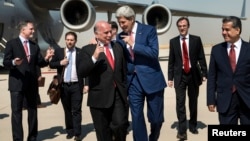 U.S. Secretary of State John Kerry (centre-right) talks with Kurdish officials in Iraq.