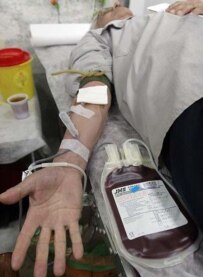 A man donates blood in Tehran in December (Fars)