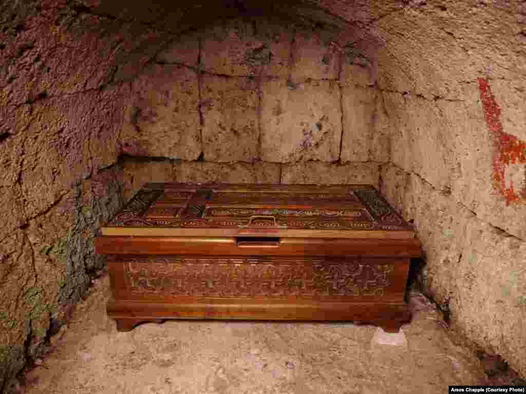 In a crypt under the chapel lie the remains of the stylite who is believed to have perished atop the pillar some 600 years ago. When asked if his bones will lie in the same crypt, Maxime answers, "of course!"