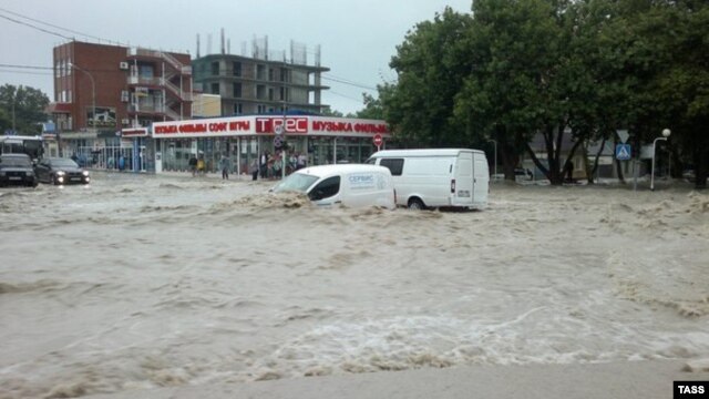 Flooding hits the Black Sea resort town of Gelendzhik on July 7, where nine people were reported dead.