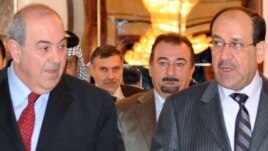 Former Prime Minister Nuri al-Maliki (right) with the head of Al-Iraqiyah, Iyad Allawi