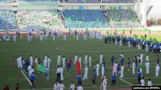 "When the president appears in the stadium, everyone will stand up and say the following, 'My beloved country Turkmenistan and glory to the Protector.' Let's practice it!" 