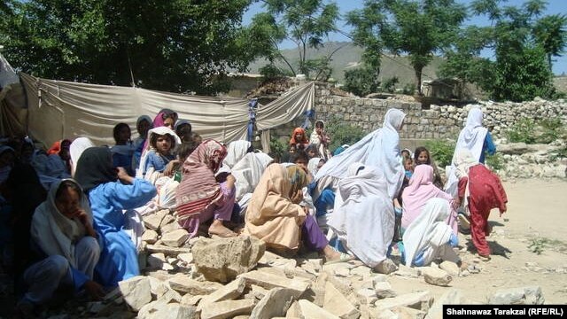 Students of a girls primary school hold class on the rubble of their school in June after it was destroyed by the Pakistani Taliban in Bajaur Agency.