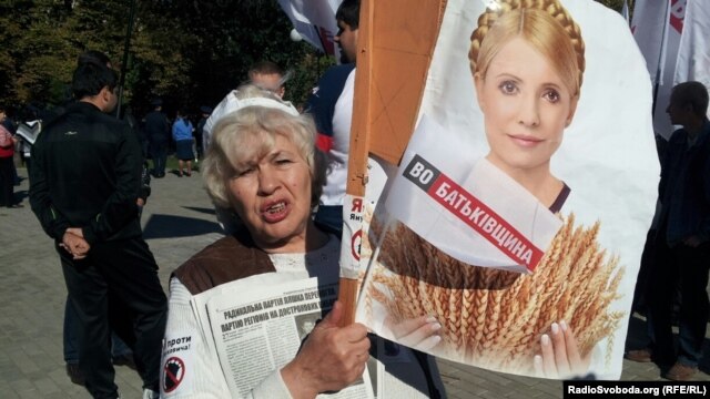 A Tymoshenko supporter holds up a portrait of the jailed former prime minister at a protest outside a courthouse in Kharkiv last week.