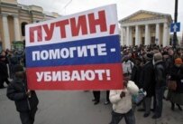 Foreign students in St. Petersburg holding a sign reading, \