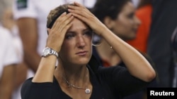Victoria Azarenka of Belarus reacts after her defeat to Serena Williams in their women's singles finals match at the U.S. Open tennis tournament in New York on September 9.