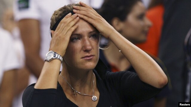 Victoria Azarenka of Belarus reacts after her defeat to Serena Williams in their women's singles finals match at the U.S. Open tennis tournament in New York on September 9.