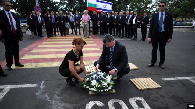  Israel's Tourism Minister Stas Misezhnikov (center right) pays his respects to the five Israeli victims of a suicide blast which targeted a bus of Israeli tourists at Burgas Airport in Bulgaria. 