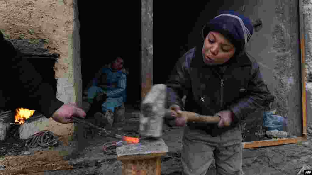 Young blacksmiths working in the northern Afghan city of Mazar-e Sharif.