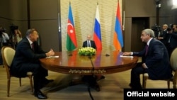 Russian President Vladimir Putin (center) hosts talks between Azerbaijani President Ilham Aliyev (left) and Armenian President Serzh Sarkisian(right).