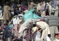 Earthquake victims receiving aid in Kashmir on 18 October