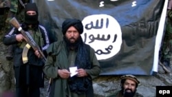 Image from a video released by the Islamic State group (IS) on January 27, 2015 purportedly showing Hafiz Said Khan, center, head of the IS branch in Pakistan and Afghanistan, at an undisclosed location on the Afghanistan-Pakistan border.