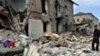 Georgia -- A man stands among ruins in front of his damaged home in Gori, 11Aug2008