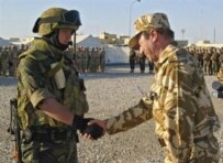 President Basescu (right) meeting with Romanian troops in Iraq in March (AFP)
