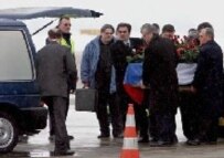 The coffin of Slobodan Milosevic is placed in a hearse by officials of the Socialist Party of Serbia (epa)