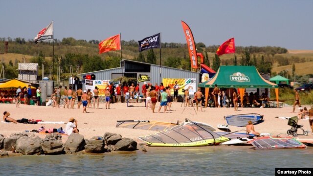 Anton Yevsyushkin boasts of the attractions of Mariupol, such as this windsurfing center.