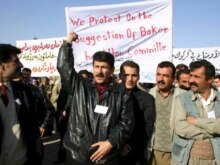 Iraq -- Iraqi Kurds chant slogans during a demonstration in the city of Kirkuk, 12Dec2006