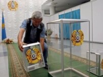 A member of a local election committee prepares a ballot-box in an electoral district in Astana (epa)