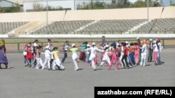 Kids rehearse for Independence Day celebrations in the eastern city of Turkmenabad.