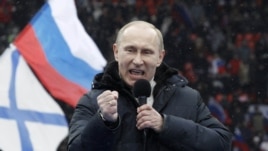 Vladimir Putin delivers a speech during the rally at Luzhniki Stadium on February 23.