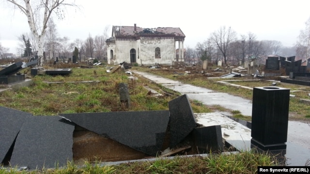 A Serbian Orthodox cemetery on a hill to the south of the Ibar River in Mitrovica lies devastated, with hundreds of headstones in shards and the chapel at its center desecrated and burned.