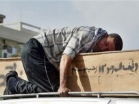 An Iraqi mourns a victim of the April 18 violence in Baghdad (AFP)