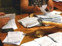 Counting ballots in Sakobo, after the May 21 voting (OSCE)