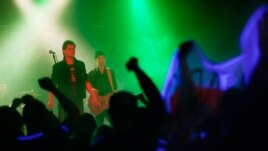 At a concert in Minsk, Miron inadvertently works the crowd into a freedom frenzy, landing himself in an army barracks.