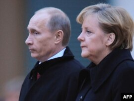 Russian Prime Minister Vladimir Putin (left) will meet with German Chancellor Angela Merkel later today.