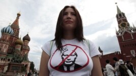 An opposition supporter defends the right of assembly on Red Square as part of a campaign protesting Vladimir Putin's presidency on May 27.