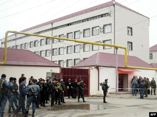 Special forces stand outside the parliament building in Grozny. At least six people were killed in the militant attack.