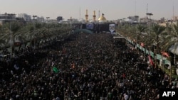 Iraqi Shi'ite Muslim pilgrims gather during the Arbaeen religious festival in Karbala on December 13.