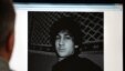 A man in Moscow looks at a computer screen displaying an undated picture of the 19-year-old Dzhokhar Tsarnaev posted on his page on vKontakte, a Russian social-media site, on April 19.