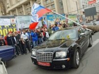 Nashi activists chase the car of Estonia's ambassador to Russia in Moscow during a demonstration last month (TASS)