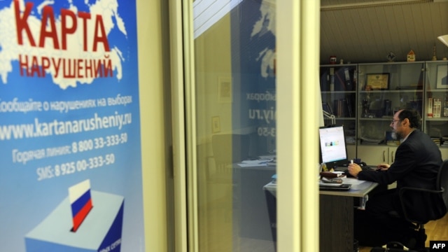 A staffer of leading independent Russian election watchdog Golos (The Vote) works at the monitoring body’s office in Moscow on December 2, two days ahead of Election Day.