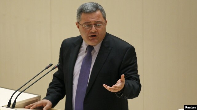 Georgian parliament speaker Davit Usupashvili signed the amnesty bill after parliament overrode the president's veto.