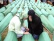Bosnian Muslim women mourn during a funeral for 465 people slain in Srebrenica by Bosnian Serb troops