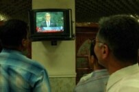 Iraqis in Baghdad watching U.S. President George Bush addressing the UN General Assembly in September 2003 (epa)