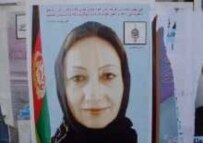 A campaign poster for a female candidate (file photo) (RFE/RL)