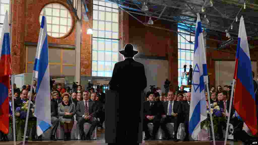 A speaker addresses the opening ceremony.