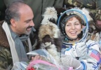 Ansari (right) and her husband Hamid shortly after the landing (epa)